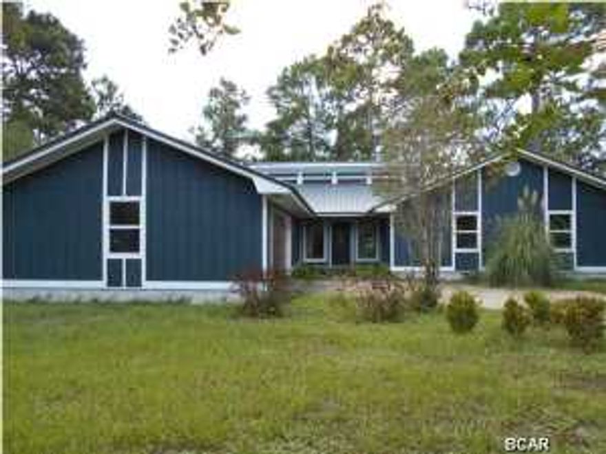 JUST APPROVED SHORT SALE!! Located in the very desirable Colony Club subdivision, this golf course front home has been partially remodeled, and is now in need of a new family to finish the job. The sellers have completed the most expensive items... a new metal roof, new vinyl clad windows throughout, all new vinyl clad sliding glass doors to the outside, and a new kitchen with oak cabinets, granite counter tops, and stone backsplash. Most of the work has been done in the 2 baths, but they are not complete. There's a new set of vinyl French doors in the master bedroom leading to a large screened in porch. With this porch, is an additional screened in area that was enclosed for their large birds. The floor plan includes both a dining area and a formal dining room, a very nice