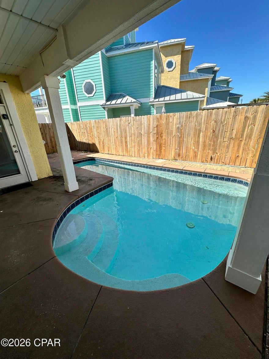 NO HOA....Gulf Views - 5 Bedroom / 5.5 Bath Beachside Investment Opportunity -Perfectly positioned just across the street from the sugar-white sands and emerald waters of Panama City Beach, this spacious 5-bedrooms, 5.5-bath home offers the ideal blend of luxury, location, and income potential. Situated between Beach Access 93 and 94, you're only steps away from the beach while enjoying the privacy of your own coastal retreat.  This home is designed for both relaxation and entertaining, featuring a private backyard pool--perfect for cooling off after a day in the sun. With five full bedrooms and five and half  bathrooms, there is plenty of space for large groups, making it an excellent vacation rental opportunity.  Located in one of the most convenient areas on the beach, you're just minutes from popular restaurants, shopping, and entertainment, while still enjoying a quieter stretch of the coastline. It's also a short drive to the airport and the scenic communities and dining of 30A.  With no HOA restrictions, this property offers flexibility for owners and investors alike. Whether you're looking for a primary residence, second home, or high-performing rental, this beachside property checks every box.  NEW AC 2026