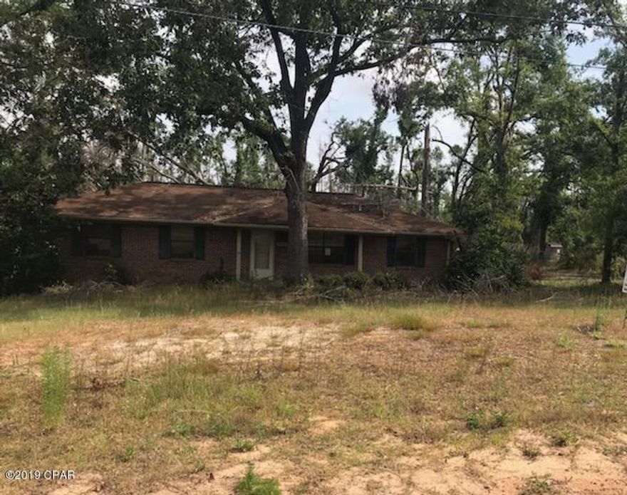 WHAT POSSIBILITIES that can be done on this 3 Bedroom 1 1/2 Bath Brick Home sitting on .83 acre! Huge Deck at Back of home. Workshop in backyard to store all your toys! Located in Dogwood Heights in Marianna. Home will be sold AS-IS. Call today for more information!