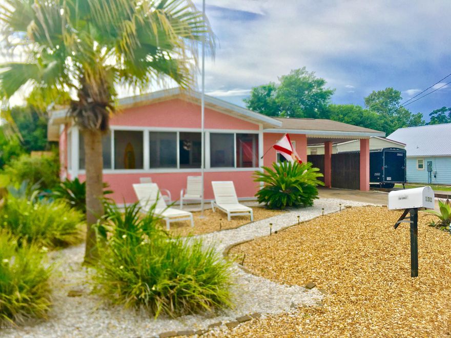 Adorable concrete block beach cottage less than 2 blocks from the beach with no thru traffic.  Located on a dead end street you will find this hidden gem ready for vacation rentals or family beach home.  Original tongue and groove ceilings, cabinetry, and terrazzo tile.  The bathroom still has the vintage tiles and  lighting in excellent condition! The spacious sunroom isn't included in square footage. Outdoor areas feature a covered car port, huge fenced back yard for pets or maybe a pool:-)