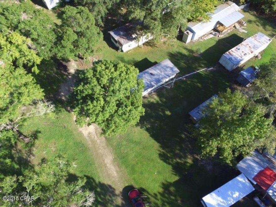 Awesome investment potential here.  Beautiful oaks surround 28 lots for campers located in the national forest all long time renters and all occupied.  Rent has been $800 a year with no increases in the past 18 years.  Each renter supplies own power pole and is responsible for own water, electric and sewage lines.  A new well is being installed currently so there will be one well per 14 lots.  This campsite is used only for weekend or hunting season get-away - no permanent residents.