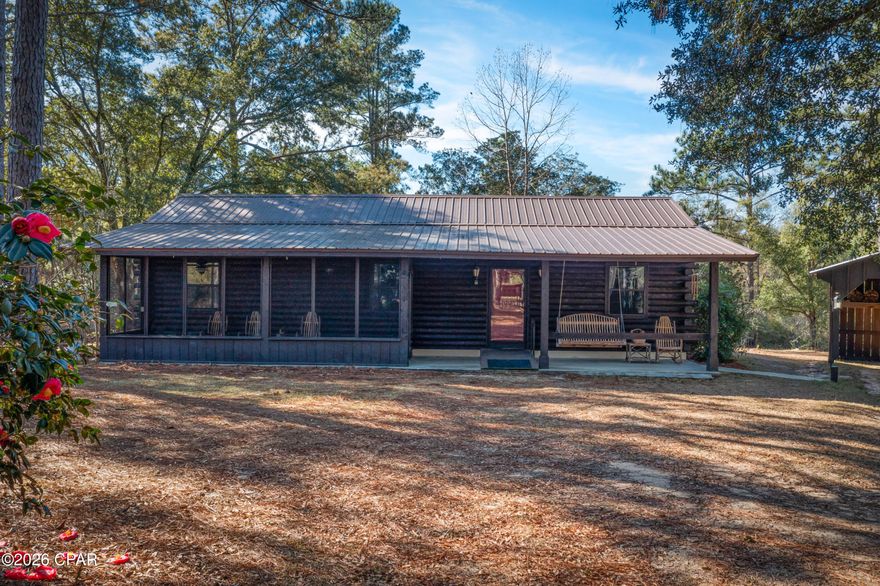 **OPEN HOUSE Saturday Jan. 17 from 1-3 PM** True log cabin gem in rural Chipley with its own spring-fed pond and spring fed creek that runs through the property! Tranquil, serene, abundant with wildlife. This 3 bedroom/2 bathroom home sits on 5.5 acres and sellers are including adjacent 4.5 acre parcel, for a total TEN (10) acres! Homesite property has easement at the front for access to 4.5 acre parcel (# 00000000-00-0002-0078). Sell the parcel, develop and sell, or keep it for your very own nature preserve and playground. Home has walk-out basement (approx. 450 SF) with separate entrance and partially plumbed bathroom. Basement has endless possibilities for a man-cave, craft room, home-based business, in-law suite, or income-property, etc.  Perfect opportunity for avid homesteaders as fruit trees, blueberry bushes, chicken coops and rabbit hutches, and garden already in place. Detached carport for easy parking. Detached garage has cabinetry for your dream shop. County-maintained dirt road. Approximately 10 minutes to Orange Hill Rd. *Metal roof installed in 2018* New well tank and pump installed 2024* Come experience all this property has to offer! Buyer to verify all pertinent information.