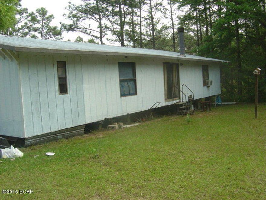 Multiple improvements with two different dwellings. Nice concrete barn/shop dwelling. Nice timber value on the 20 acres. In ground pool that needs repair.
