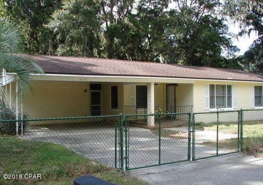 Single story homewithin minutes of Tyndall Air Force Base, shopping, and dining. There is a city park across the street and easy access to a small lake one block away. This home features a laundry room and second bathroom attached to the house under the two car carport. It also has an extra bonus room, with fireplace, that can be used as a 4th bedroom and a detached large shed with an electric roller door. The screened in area and large fenced in yard is perfect for enjoying the warm Florida summers. 



All measurements are approximate.