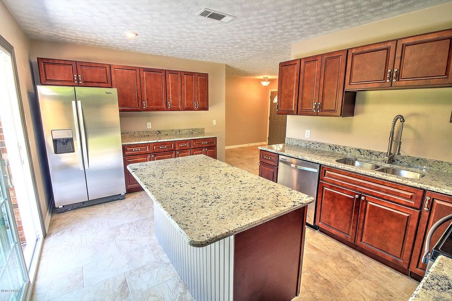 Like new, new, new! Beautifully remodeled home convenient to shopping, schools, and Tyndall AFB. Home features 0.2 acre lot, gorgeous kitchen with all new cabinets, granite counter tops, stainless appliances, island/breakfast bar, modern tile, and commercial style faucet. Attached garage, large master bedroom with lovely master bath, large back yard. New roof, new double pane vinyl windows, new HVAC, new flooring, new paint and more!