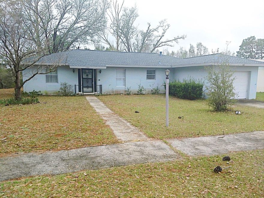 This three bedroom two bath features a spacious open floor plan. A dining area, living room, and open adjacent Florida room leading out to an open concrete patio makes the home feel large and very comfortable. Both bathrooms are tiled on the floor and walls. Between the two additional bedrooms you'll find a jack and jill bathroom perfect for the kids or guests. Carpeting throughout the home has been maintained and cared for. The home features a brand new shingle roof and central heat and air. There is a single attached garage with work place. In the back yard is a spacious quanset hut on a concrete slab with a 14 ft roll up door, pedestrian door, natural skylighting, and motorized shop door opener. This home is ready for its new owners!