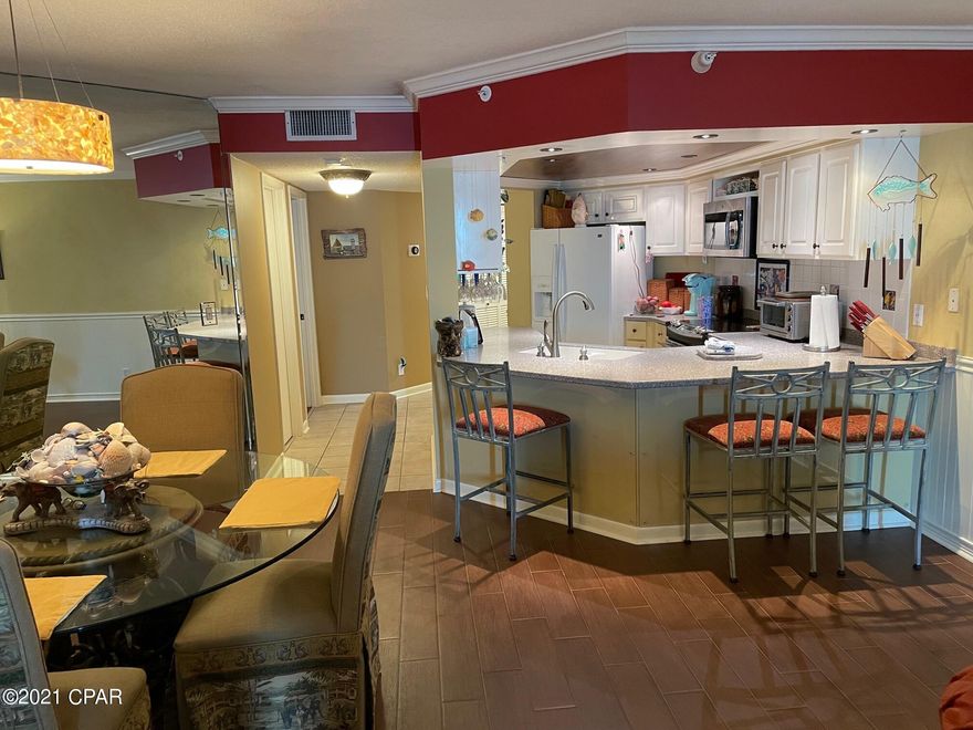 Welcome to Summerhouse! Long walks on the sugar sand beaches of Panama City Beach and endless sunsets, each more beautiful than the last await. Two bedroom, two bath eighth floor unit has been our home away from home since 2007 and has not been rented in over 10 years.  Wood plank style tile flooring professionally installed throughout the living area and bedrooms, chair rail and wainscoting in living room and entryway, upscale appliances and electronics throughout. Living room and bedroom patio doors were replaced with top of the line Windoor brand doors with impact resistant glass and turtle gray tint. We are going to miss our beach home but it is time to let others enjoy the beauty that is Summerhouse.