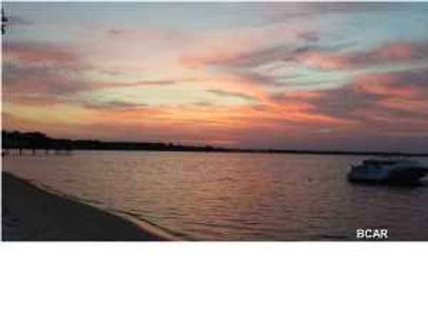 Stunning waterfront condo in Magnolia Bay Club. This first floor 3 bedroom condo is perfect for an investment or retirees looking for peaceful and private low maintenance living. Enjoy beautiful views of St Andrews Bay from the living area and the Master Suite. You can also sit and enjoy the views from your large covered patio. The condo has tile floors and crown molding throughout. The open kitchen features granite counters, solid wood cabinets, stainless appliances, and a raised breakfast bar. The master suite is off the living area and the bathroom includes a large walk in shower, separate jetted tub, double sinks and a large walk in closet. The second bedroom has a trey ceiling and a private bathroom with double sinks, built in corner cabinet and a large walk-in closet. The