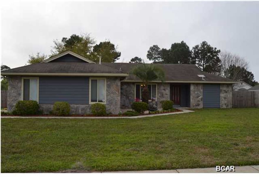 Completely renovated 3 bedroom, 2 bath home located in the popular Callaway Point neighborhood, just steps from the Bay. This home is situated on a huge corner lot with plenty of parking and additional boat parking behind the privacy fence. The interior of the home looks and feels like brand new with an amazing, high end kitchen with granite counters, stainless appliances, double convection oven, gas cooktop and a desk/study area. You won't find a finer kitchen in this price range. A breakfast bar separates the kitchen from the huge great room with a wood burning fireplace and stylish porcelain tile throughout. For formal dinners there is a dining room that is open to the great room. The master bedroom just received a makeover with new carpet, a custom vanity with granite top and a