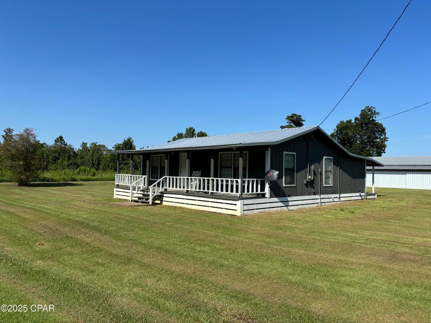 NEW IMPROVED PRICE! Renovated farmhouse on a street just outside town. Warm, inviting interiors lead to a luxurious kitchen with a calm and relaxing theme throughout the house. The private primary suite features a spa-like bath with a soaking tub. Outdoors, mature plantings elevate the setting: satsuma, fig, and grape vines for seasonal harvests. A large pole barn, fully enclosed with four barn doors, provides flexible space for projects, vehicles, or equipment. Conveying items add value: 85'' TV, all appliances, and a zero-turn CAT lawn mower. Enjoy peaceful country living with modern comforts and easy access to in-town amenities. Buyer to verify all measurements and information important to them.  Seller has cameras in the home and outside of the home that come with the house.