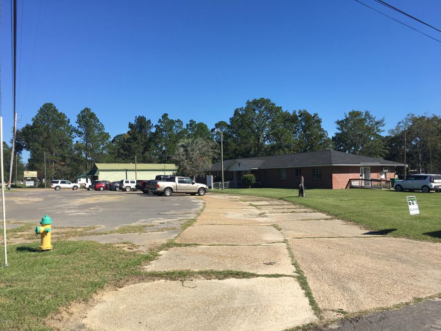 2.272 Acres in Graceville, corner lot, fronting 3 roads, Public Water and Sewage available PLUS 3 RENTED! buildings, Building #1: 4020 Sq Ft professional office space, Building #2: 1560 Sq ft professional office space. Building #3: Residential or Commercial, 625 Sq Ft ALL LONG TERM TENANTS!! PAVED PARKING FOR 20 PLUS AND PLENTY OF ROOM FOR EXPANSION!! IMEDIATE OCCUPANCY IS AVAILABLE Seller will consider dividing the property. 2018 property taxes : $2340.