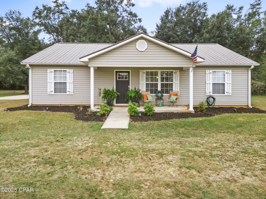 Built in 2005 and set on approximately 1.12 acres in an established Blountstown neighborhood, this 3-bedroom, 2-bathroom single-story home offers 1,896 square feet of heated living space and 2,464 total square feet under roof. The property combines privacy, usable land, and proximity to town.

The interior features an open living, dining, and kitchen layout that keeps the main spaces connected for everyday living and hosting. The split floor plan places the primary suite on one side of the home and the additional bedrooms on the other. Interior finishes include drywall, ceramic tile in common areas, and carpet in bedrooms.

The primary suite functions as a private retreat within the home. The kitchen provides ample counter space and sightlines into the main living area.

Construction details include siding exterior walls, a durable metal panel roof, central air conditioning, and ducted heating for year-round comfort. The lot offers room for gardening, outdoor seating areas, play space, or future improvements.

Location provides lovely surroundings and access to daily needs. Shopping and dining in Blountstown are only minutes away, and the Gulf Coast is approximately one hour away.

Private showings available.