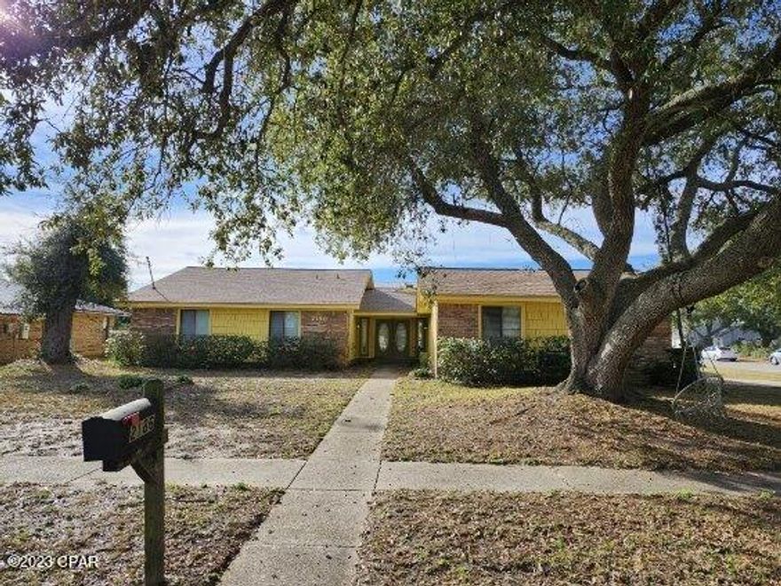 Fixer upper in King's Ranch subdivision. 4 bedrooms and 2 full baths. New roof installed in 2019, new HVAC and heat pump installed 2023. Large living/dining combo with wood burning fire place, bar, and bay window. Kitchen features a walk in pantry and breakfast bar. Master bath features 2 separate vanities and walk in closet.  Full bath features double vanity, small linen closet, and shower/tub combo. Home also features a spacious laundry room, an attached 2 car garage, covered front and side porch, and a shed in the backyard. Property needs TLC and has termite damage. Centrally located and convenient to schools, shopping, and Panama City Beach. Seller has never occupied the property and can make no guarantees. Buyer to verify any pertinent information. Property is being sold AS IS. No repairs will be made.