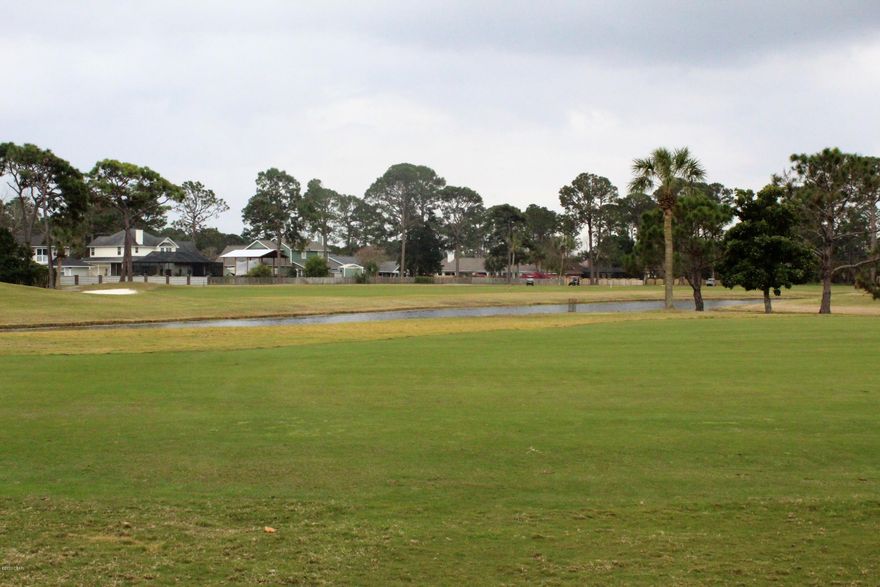 Lot backs to Holiday Golf Course for a beautiful view in the Lovely Trieste Gated Community filled with Mediterranean style homes.  Location is very convenient close to beach,dining, shopping and pier park.  Come build your dream home!!  Seller is a licensed broker in the state of Florida.