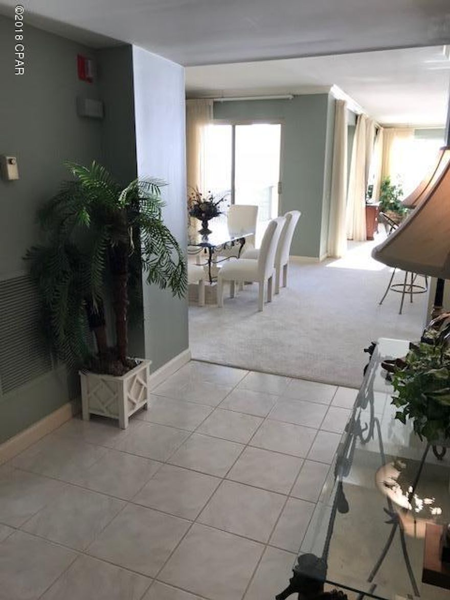 Exclusive residential living at its' best! One of only two fully non-rental condos on PCB and what a beauty this is!This pristine unit provides luxury condo living with magnificent views overlooking the emerald and turquoise waters of the Gulf of Mexico as well as one of two pools in the courtyard all from the second floor windows and balcony! Unlike many condos, this floor plan was designed for permanent living with great closet and storage space, fabulously large living room, dining room, kitchen, and bedrooms! Don't forget the private one-car garage big enough for storing tons and even keeping a spare fridge or freezer!Amenities include well-equipped workout facility, two pools, car washing stations, and clubhouse space for owner's parties and gatherings!