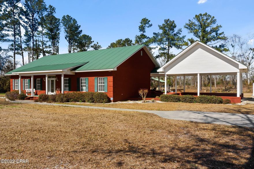 LOCATION! LOCATION! LOCATION! Wonderful well maintained home on over 6 acres. Large Pole Barn steps away from the pond. Three bedroom, two and 1/2 baths split bedroom with jack and jill bath between them. Kitchen has granite counter tops, under counter ice maker, cooktop with down draft, dw, fridge and wall oven. Enjoy evenings on the screened porch overlooking the pond. Two car attached carport.