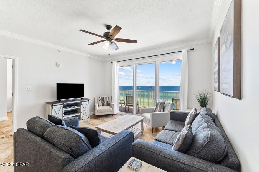 This three-bedroom, two-bath gulf-front home is convenient beach living within a low-density tower of just 80 units. Grandview East is known for its larger-than-average layout and incredible gulf-front views, and this unit will not disappoint. Tile floors grace the entire unit along with tasteful decor in muted shades. The living room is perfectly positioned for appreciating the views of the sparkling Gulf of Mexico through sliding glass doors. There's ample space for a family-sized dining table before reaching the open kitchen which has a pantry and white cabinets providing heaps of storage. Granite countertops and matching white appliances enhance this well-appointed space. The long bar can easily seat four diners for breakfast or pre-dinner drinks and snacks. Outside, the generously sized balcony provides ample space for outdoor living, dining and relaxing. Ideally located on the sixth floor, it captures the best views while still being low enough to be part of the beach and surf. Three generously sized bedrooms are served by two bathrooms including a master ensuite. Both have a shower and tub combo. The spacious gulf-front master bedroom also has a walk-in closet and access to the balcony, providing the perfect spot for that morning coffee while watching diving pelicans. Located on a quieter part of Front Beach Road, this very liveable unit can easily sleep up to eight guests without bunks. It's a great choice for anyone looking for steady rental returns. The condo comes with a community pool, secure parking and private beach access via a key code. Pier Park is just 10 minutes away and local shops, supermarkets, restaurants, activities and golf courses are even closer.