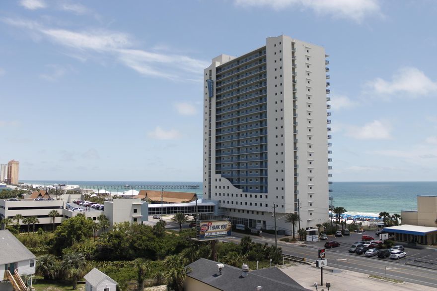 End unit in a Gulf Front Condominium Complex extremely popular with owner's and guests. The attractions and amenities of Pier Park and Russell-Bissant Pier are within walking distance. The unit enjoys both Sunrise & Sunset vistas. The main Living Spaces of the Kitchen, Dining Area and Living Room enjoy an Open Floorplan Concept and more importantly have views of the Gulf of Mexico. The owner's suite is Gulf side, has access to the Gulf side balcony and views of the Gulf from the bed. The Owner's Bathroom is spacious has His & Hers Vanities, and a Floor to Ceiling Tiled Shower. The 2nd Bedroom has an Eastward view down the beach and an attached Full Bathroom with Tub/Shower Combo. The 3rd Bedroom is set-up as a Double Bunk Room. Might be your perfect rental investment, 2nd or vacation home.