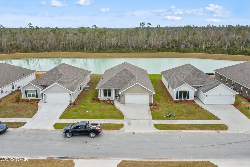 New Construction by Truland Homes!  Nice 4 bedroom 2 bath home, bonus room, island kitchen with open floor plan and split bedroom plan.  This home features the ring doorbell, ADT SMART SYSTEM, Nest energy efficient thermostat.  10' ceiling in the living area, 9' tray ceiling in the master bedroom over looking the pond, ceiling to floor windows, vinyl plank floors, granite, countertops and so much more throughout the home.  The home has TECO natural gas for the stove, tankless water heater and heat, front and back porch, landscaped yard with sprinkler system and fenced backyard overlooking the pond.