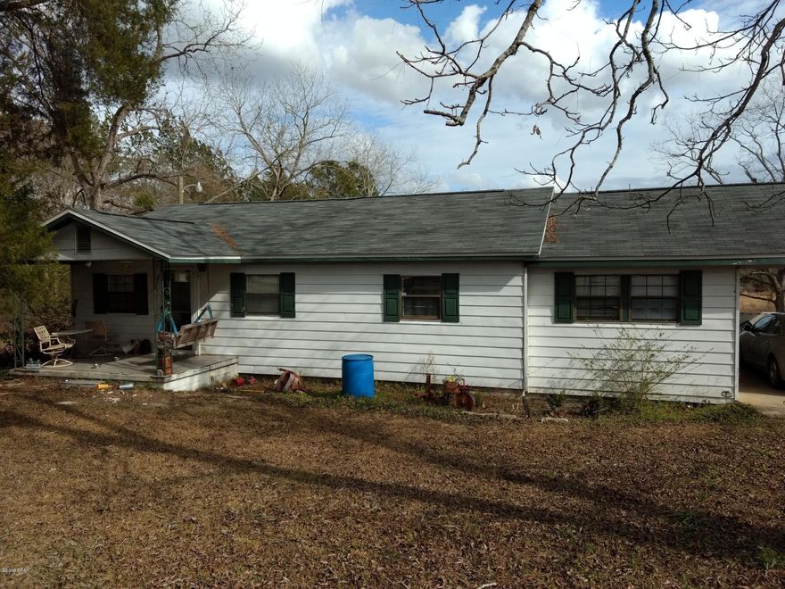 GREAT DEAL! Two houses on over 8 acres, with lots of frontage on 79 and Spring Valley Rd. located north of Bonifay. Property is mostly cleared, fenced and cross fenced, with large fish pond, would be great place for horses. Main house is in good condition with a fairly new roof, presently being rented. Smaller house is in need of repairs, would make a nice guest house or rental with some renovations. There are two barns on property. Make an appointment to see today.