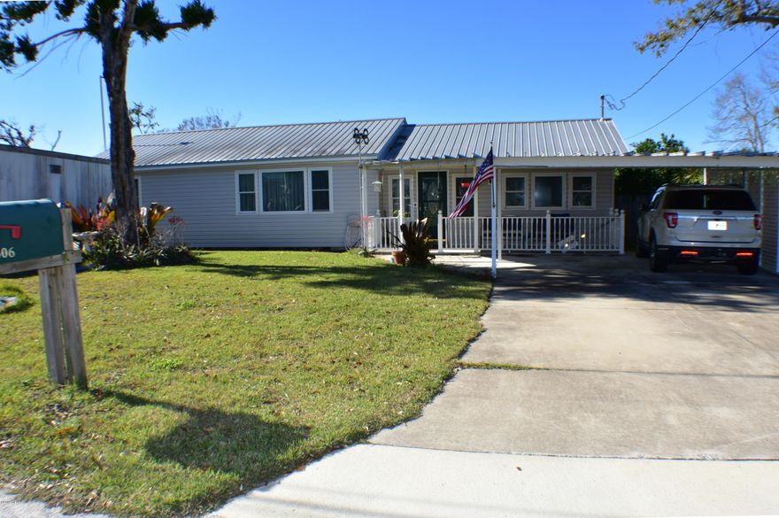 CURRENTLY UNDER CONTRACT, SELLER ACCEPTING BACKUP OFFERS.SELLER MOTIVATED! Lynn Haven home - LOTS of extras!  Main home has 2BR/1BA & a bonus room that could be a guest room; there is a 20x60 detached garage w/a 1BR/1BA apartment, and there is a 20x12 building that could be used as an office, studio, guest suite, etc...  many possibilities with this property. The seller says there was NO storm damage.  Main home includes a metal roof with diaphragm, hardwood & wood laminate flooring, & the kitchen was recently updated w/all new cabinets & appliances.  Floor plan features a formal dining room, living room, den & a bonus room.  Detached garage/workshop has 220' amp power & the apartment boasts an additional 30' storage cubby.  The apartment also has its own lift statio Off the home there is a great open deck that extends down to a covered front porch over the bonus building.  There is also another storage shed with a lean-to for extra coverage.  So many great options with this home and you need to see it for yourself!  You're also convenient to schools, shopping, parks and so much more!  All info is approx and must be verified by Buyers if important.
