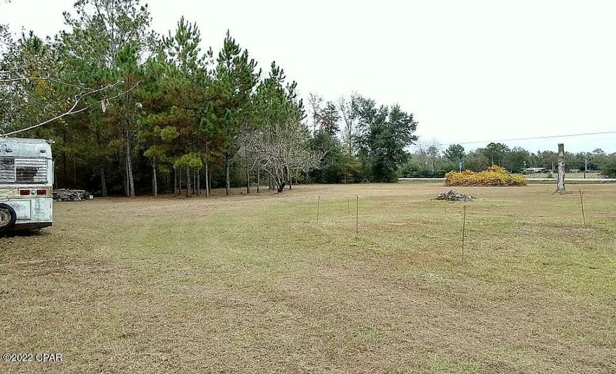 Beautiful 5-acre lot located within short driving distance from the Intercoastal Water way and just minutes from downtown Port Saint Joe. This property has two septic systems, two wells 1 shallow 1 deep, power, and two buildings with car ports 20'x36' and 24'x40' and a fenced in area. Had a mobile home at one time but can be setup with a camper, modular, or framed house. The property can easily be turned into commercial as well. Great Opportunity! Build your dream country home or set up your weekend camp!