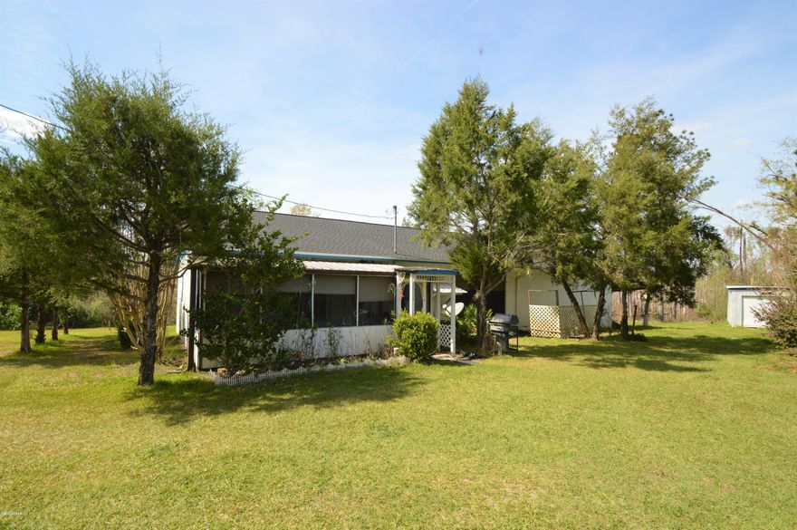 Very private home sitting on 12 Acres and a Pond! This home is small but has an addition that can be finished to make it a really large home,29' X 38' unfinished workshop that is waiting to be turned into heated and cooled sq footage . A perfect Get A Way place to relax. This home is close to town but very private country life! Also includes a 31' Camper if you have guests come to relax and fish. home also has storm shelter.