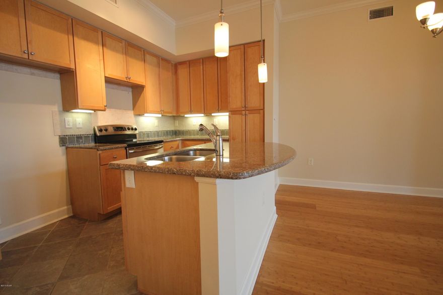 This 2 bedroom 2.5 bath condo at Island Reserve has a beautiful courtyard view and is close to the parking garage, so no more long walks back and forth to your car. Inside the condo you’ll find 10 ft ceilings, bamboo hardwood floors, and beautiful granite countertops in the kitchen and both Master bathrooms. The Living Room and Both Bedrooms have access to the private Balcony overlooking the meticulously manicured grounds and several serene courtyard fountains.

Island Reserve features low association dues and unbeatable amenities including the largest pool in the Bay County area (1 acre) w/ two waterfalls, a Splash Pad for the kids, numerous seating arrangements for your poolside entertaining, a heated and cooled indoor basketball court, fully stocked state of the art fitness room, a game room, a theater with an 105 inch screen, gated community with security. Plus, no short term rentals are allowed in Island Reserve so that means no heavy Spring Break/Summer traffic. Island Reserve is an oasis away from all the hustle and bustle of Panama City Beach, but in a prime location: just a little over a mile away from both the World's Most Beautiful Beaches and the Hathaway Bridge. Maintenance-Free, Luxury Resort Living close to everything in Panama City Beach. The Beach is only 1.4 miles away or a 3 minute drive from Island Reserve.