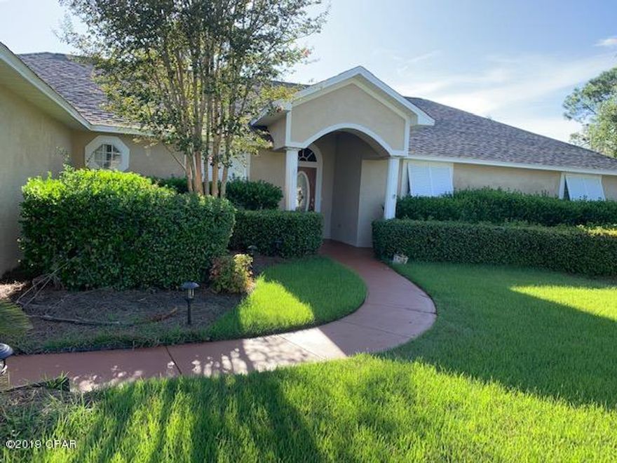 This beautiful and spacious home, inside and out, was originally custom-built for builder's personal use.  The well-laid out home features include an expansive entry way, designer tile flooring, elegant crown molding, and exquisite tutor paneling. This 3- bedroom, 3-full-bathroom home also features such extras as a study, separate ''computer room,'' and a heated and cooled, INDOOR  WORK/HOBBY ROOM off the garage.  Home has both a living room as well as a media room (that is prewired for surround sound).  Master bath has double sinks and a double shower.  All overhead lights are LED bulbs, and the garage door opener is WiFi-app enabled.  Irrigation system draws from a private well. The home lends itself to entertaining, opening to the covered and enclosed lanai, shimmering gunite pool with Dolphin Fountain, and hot tub.  There is even a separate grilling area with natural gas hook-up! Large fenced backyard backs up to an expansive wooded area, has double gate, and also has an outdoor shed.  And, if this is not enough to be ''the one'',home also features Hurricane Shutters and a "Whole Home Generator" system for protection from inclimate coastal weather.  Just a few short minutes to the beach, restaurants, medical offices, and churches, and less than 1/4 mile to Gayle's Trails.  Come see this home and its many, outstanding, unique details!!
All measurements, age & square footage are approximate, buyer should verify, if important.