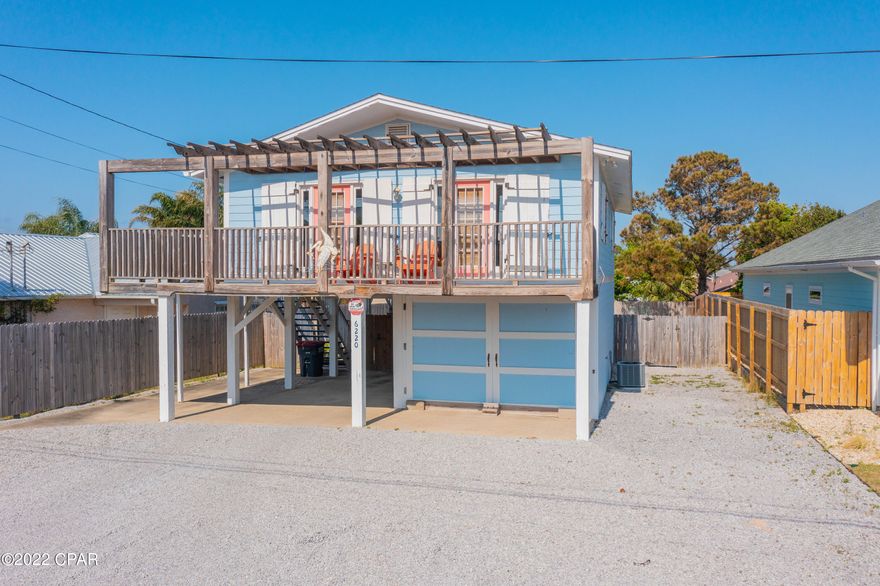 CURRENTLY UNDER CONTRACT, SELLER WILL CONSIDER BACKUP OFFERS. Bright, colorful and beachy this adorable cottage is a rare turnkey, fully furnished 5-star rental with transferrable bookings! Step into this delightful low maintenance property on the East End near all the water activities with new roof 2019, new AC system 2018, & new windows.

Carport covered parking AND garage with plenty of storage for toys. Huge driveway with Parking for 6+. Fenced in yard with gate, low maintenance yard with fire pit. Enclosed outdoor shower. Open concept kitchen with stainless appliances. Beautifully updated interior with custom crown moldings throughout. Don't miss this fantastic super hosted property that would be an awesome primary, vacation rental or second home.