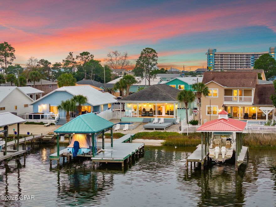OPEN HOUSE -- Saturday (2/7) 10am-2pm. 

Discover your personal waterfront sanctuary on Grand Lagoon—a rare gem that blends effortless luxury with the serene rhythms of coastal life. This beautifully maintained 3-bedroom, 2-bathroom home offers 1,537 square feet of thoughtfully designed living space and panoramic lagoon views that will take your breath away.

Step outside and discover a private paradise designed for both relaxation and recreation. From the paver-lined drive to the low-maintenance Bahama rock landscaping, every detail speaks to ease of ownership. The Trex decking flows seamlessly to a covered dock outfitted with a boat lift, inviting you to launch into St. Andrew Bay or head straight to the Gulf. A heated and cooled pool ensures year-round enjoyment—ideal for cooling off on warm afternoons or enjoying a quiet dip under the stars.

Inside, the open-concept layout is bathed in natural light and oriented toward the water, framing postcard-perfect views at every turn. With furnishings negotiable, this turn-key retreat is ready for immediate enjoyment or prime for short-term rental income. Located just moments from the beach and surrounded by three convenient boat launches, it's the ideal home base for boaters, beachgoers, and dreamers alike.

Whether you're seeking a permanent residence, a vacation hideaway, or a high-performing investment property, this Grand Lagoon gem checks every box. Waterfront opportunities like this are becoming exceedingly rare—don't miss your chance to own a slice of paradise.

Reach out today to schedule your private showing. All information and measurements are deemed reliable however not guaranteed. Buyer should confirm all information.