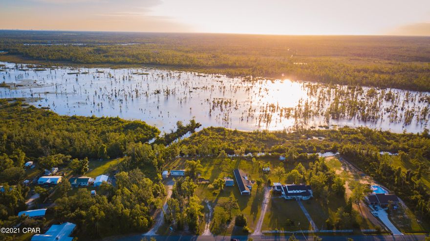 This is your chance to own a Fishermans paradise. This one acre lot is fixed right on bear creek. The canal that the property backs up too,  offers easy access to bear creek and Deer point lake. There is a public boat ramp a half mile away from the property. The property has electricity, shallow well, and a septic tank already installed. This lot is ready for you to build your dream home on. Don't miss out on this great opportunity.