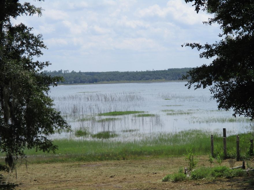 Bring the family to your new lake front property on beautiful Hicks Lake.  Enjoy the peace and quite while fishing, swimming or just relaxing by the lake on your private beach.  You can bring the ATV, the boat with motor as you are allowed to use gasoline engines on Hicks Lake. This property includes two lake front lots for a total of 6 acres, fenced with a concrete driveway leading from the road to the large utility shed and car port.  There is also a large concrete pad near the water.  There is a well and septic on the property (seller has no knowledge of the working condition of either buyer must have it inspected if important).