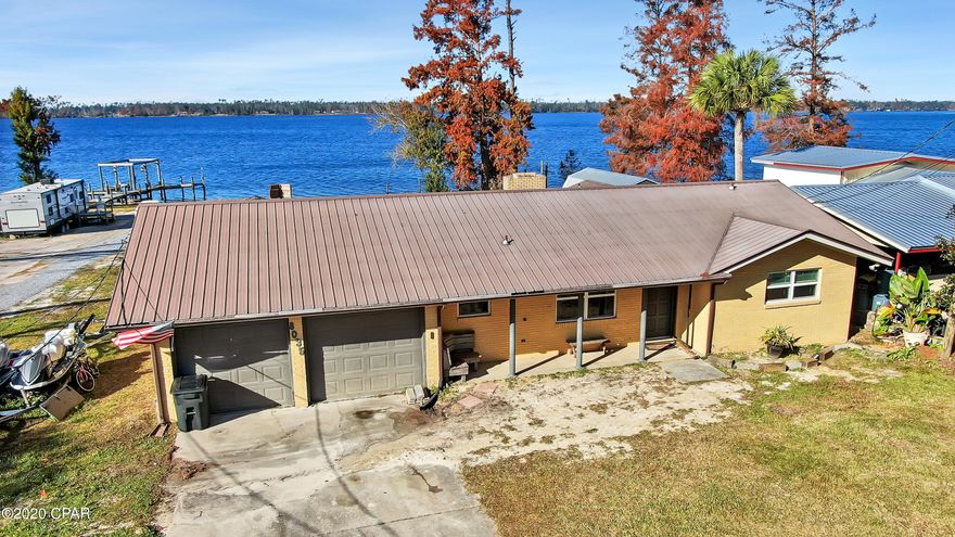 Come see this waterfront oasis! This 2 bedroom (plus unfinished bonus room), 3 bath home located on Deer Point lake, is approximately 100 yards from a public boat ramp. Perfect for a sportsman/woman and on a large near half acre lot. This secluded quiet neighborhood 10mins from town.



Enjoy stunning sunsets from your large back porch which features pecky cypress finish. Large french doors and large windows that give you panoramic views of the lake from your living room. Kitchen features all new stainless steel appliances and no touch sinks. Newer LVP floors throughout for durable easy to clean living.



Equipped with an artesian well and energy efficient throughout will keep your monthly utilities lower.



All measurements are approximate and should be verified if important