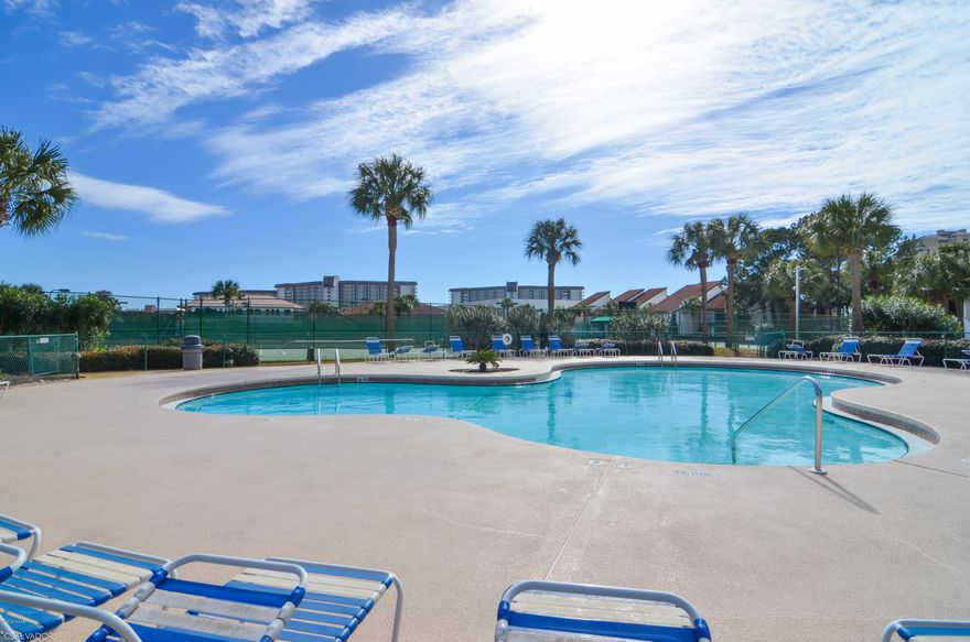 This spacious, ground floor unit is located in the gated Beach Resort of Edgewater. This unit is only yards from the community pool and 3 minutes to the Beach. The location of Edgewater is amazing. It is located in the heart of Panama City Beach close to restaurants, entertainment and shopping. But the best feature of all is Edgewater's wide range of amenities. This is one of the few beach resorts that offer its own onsite golf course, salon, snack bar and grill, roaming security and a convention center. The resort also offers tennis, many pools, hot tubs and of course beautiful beach front. This is a villa unit that sits right behind the tennis courts and the pool. Plenty of room for the whole gang! What a great opportunity!