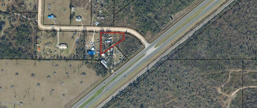 Almost 1 full acre situated just South of Bear Creek just off of Highway 231. Well and septic on the lot. Burnt mobile home on the property needs to be torn down. Value is in the land.