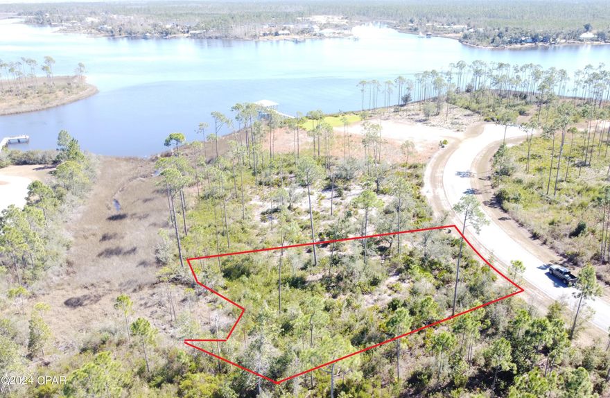 A beautiful homesite in the desirable Laird Bayou. At half an acre there is plenty of space for you dream home. Experience water views from different directions, build a two story home to unlock the possibilities of truly amazing views. Just steps to the Community Pool and Bathhouse. Boat launch inside the community so every lot has water access. No waiting in long lines at public ramps to launch your boat. Rv/boat storage as well. Laird Bayou is a gated waterfront community with ribbon curbed streets and underground utilities. Beautiful custom builds throughout. Schedule your tour today!
