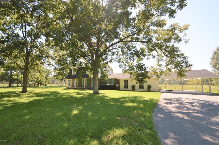 Looking for a place in the Country...Drive the paved drive leading to  2 story home sitting under Pecan Trees on 1.83 acres.. Home features large family room with stone fireplace. Kitchen has lots of cabinets with walk in pantry. Master bedroom is downstairs with walk in closet master bath has separate shower and jetted tub. Spacious utility room. Upstairs is 2 bedroom and extra room that could be fourth bedroom. Large workshop/ storage building.