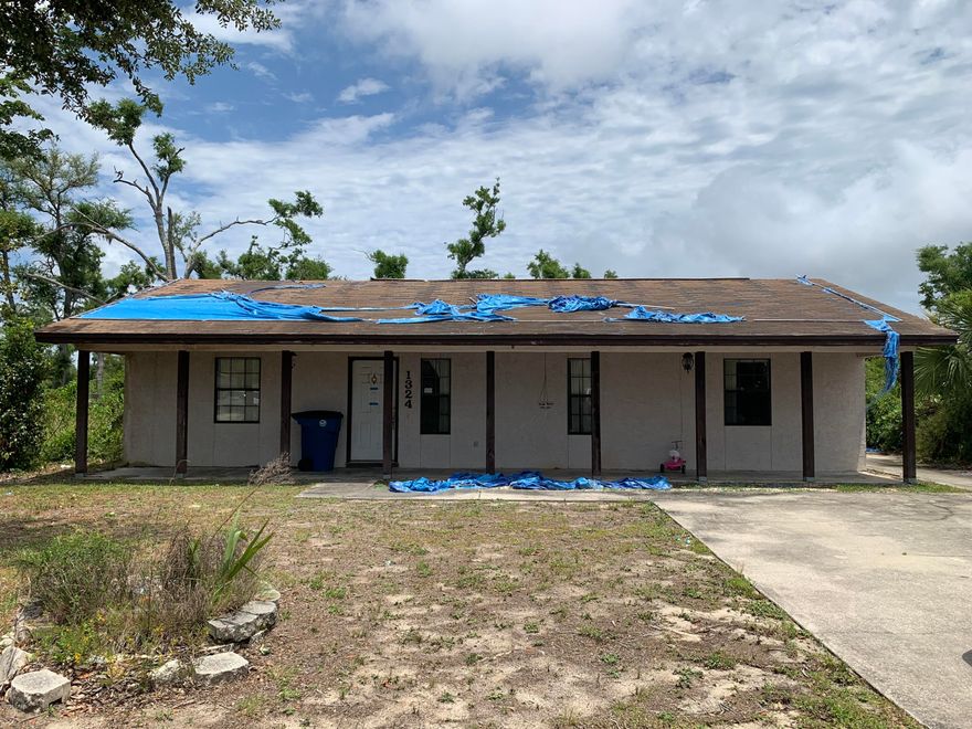 Hurricane damaged house needs a lot of work.  Be aware of possible black mold and termites damage.  Shed in back severely damaged as well. Close to downtown, shopping, dining and beaches.  The power is not on in the home due to the amount of damage.  Home is a short sale and sold strictly AS IS.