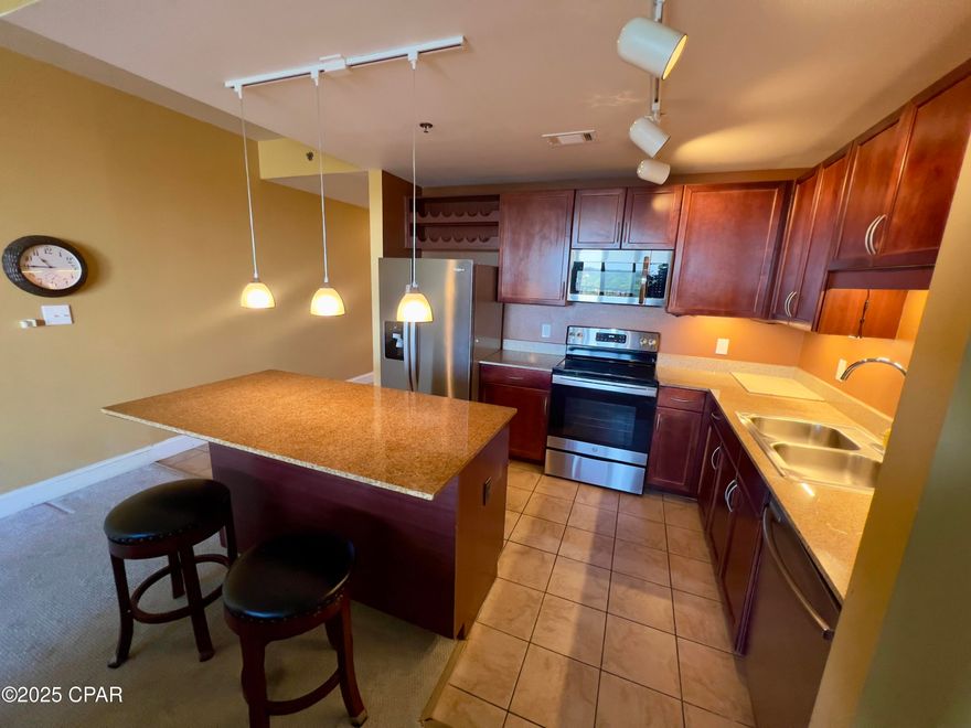 This unit is the owners personal unit and hasn't been rented since purchase. It is a lovely 2 bedroom, 2 full bath with a bonus bunk room condo. This home has stainless appliances, granite counters in kitchen and bathrooms, undermount lighting, includes all appliances and  includes the stacked washer and dryer. Your GULF & Pool area views are incredible from the front door and Lake View and boardwalk views from the balcony. COA is reasonable and include : Insurance, Cable, Internet, Water, Garbage, Pest Control, Amenity usage and 2 car parking in the 10 story garage with parking passes. Enjoy 5 pools, boardwalk with shops and restaurants, pickleball, 2 story gym and private coded gate access to the beach! Unit comes completely furnished.