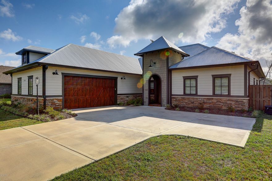 Spectacular, very spacious 3 bedroom 3 bath home in the gated community of Lake Merial.   The home offers quality features and accents such as hardwood floors and  tile flooring, designer lighting package,  10 ft. and 12 ft. ceilings, amazing arched ceiling in the foyer, and so much more.  Home has a gourmet kitchen which boasts Carrera marble counter, a 10x5 island, oversized butlers pantry, Fischer  & Pakel dishwasher, 36 inch. gas commercial range, under counter microwave, retractable  kitchen cabinets and even a wine cooler, making this an amazing kitchen for entertaining. You will find the spacious master suite is truly a retreat, with large custom California closets, free standing tub, decorative tile flooring, plenty of storage space, sitting area which over looks the private nicely landscaped yard.  All bedrooms have plenty of space and all offer a rainfall showerhead with floor to ceiling tile in the wet areas. The family room opens to the lanai and a 15x30 in-ground pool again making this the perfect home for relaxing and entertaining.  Lake Merial is a 300 acre gated lake front community with private owner access to the lake for swimming, kayaking and fishing.  The community has 2 natural spring fed lakes, white sandy beaches, park areas, picnicking or relaxing. Age, sq. ft. , lot and room size are approximate measure if important.