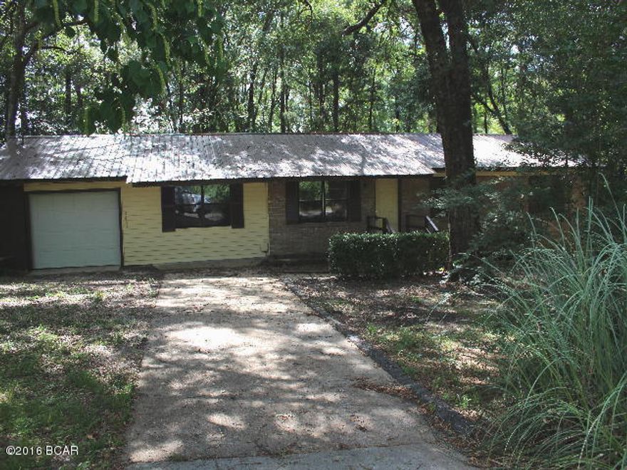 ** BIG PRICE REDUCTION** This is a renovated like new home in town! Sits on a nice shaded lot. Has all new kitchen with stainless steel appliaces; side-by-side refrigerator-freezer, dishwasher, microwave and stove.Has a new rear deck just right for cook-outs. There is a formal living room, den and a 2 car attached garage. Don't wait! Being sold AS IS.