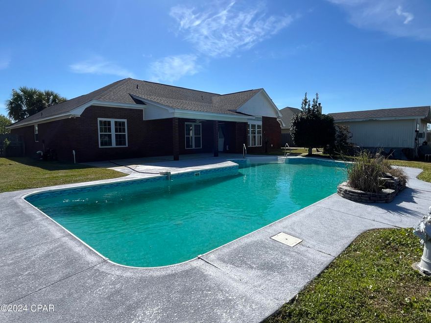 Beautiful brick home with pool, located in Mowat Heights. No HOA!! This 3 bedroom 2 bathroom home features high ceilings and crown molding, title floors through-out the house along with new carpeting in the bedrooms, this home is spacious with its 2,335 sq ft.  
Very large kitchen with island and eat in area. The pantry, laundry room and attached double garage are off the kitchen. There is a formal dining room or it can be used as office space. The living area has a gas fire place, the large windows in this room let in a lot of natural light along with a view of the pool in the back yard. The master bedroom with attached bathroom includes double vanities, 2 large walk-in closets, large shower and a whirl pool tub. The other 2 bedrooms are on the other side of the home, sharing a bathroom with a double vanity. 
The in ground pool has a new liner and pump is only a couple years old. 
Fenced in back yard with privacy fence. 
The home has newer windows and roof. 
There is also a storage/work shop in the back yard approximately 12.5 x 30.
There is a well with a new pump for irrigation.