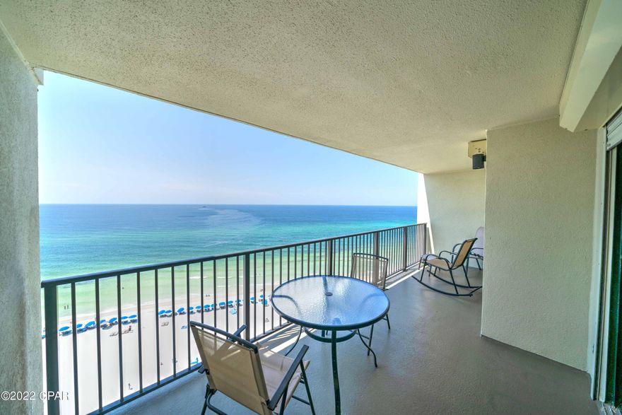 CURRENTLY UNDER CONTRACT, SELLER WILL CONSIDER BACKUP OFFERS // FRONT 1 bed, 2 bath fully furnished condo that has never been rented at the highly desired Commodore Condos with a separate storage unit included. This unit is located on the top floor and boasts gorgeous Gulf views from the living room and primary bedroom as well as views of the Lagoon from the kitchen. Sliding glass doors off the living room and bedroom offer access to the large balcony, perfect to bask in the Florida sunshine and salty air. The sliding glass doors are secured with automatic storm shutters. This condo boasts beautiful tile in the living area, recent carpet in the bedroom and has been recently painted. The living room, dining area and kitchen feature an open floor plan, creating a grand spot to host family and friends while enjoying the Gulf views. The kitchen is equipped with a breakfast bar, recessed lighting, white appliances, and a pantry. There is a full guest bathroom with a shower/tub combo with access from the living area for the ultimate convenience. The primary bedroom is spacious and boasts beautiful Gulf views, a walk-in closet and a private primary ensuite bathroom. The vanity and walk-in closet are separate from the toilet and shower room. Washer and dryer convey. Separate storage unit is located just outside of the unit. The Commodore features a 24-hour security guard, a heated pool, a kiddie pool, a whirlpool, a covered picnic area and a boardwalk to the white sandy beaches. This complex is located near St. Andrew's State Park, many local restaurants including Gulf-front eateries, family friendly activities and more! This condo is a short drive to Pier Park featuring eye-catching restaurants, The Grande Theatre, the SkyWheel, an amphitheater and more. Check out this fantastic condo today!