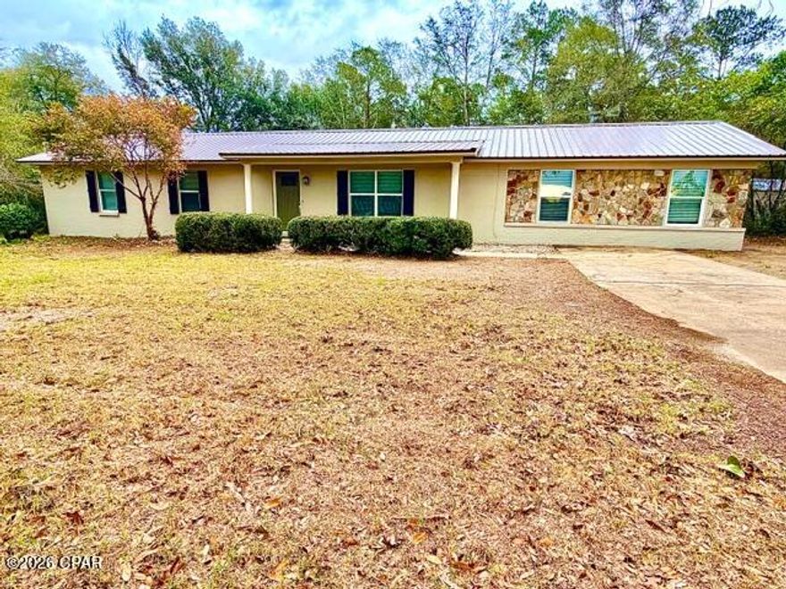 Check out this beautifully remodeled 3-bedroom,2-bathroom brick ranch in the serene town of Graceville. Just a short walk from the charming downtown area, this home is ready for you to move in and enjoy the delightful North Florida spring weather. The property spans over an acre, offering ample space for your toys, RVs, a large workshop or pole barn, or even a pool. Inside, you'll find new appliances, flooring, paint, and lighting fixtures. The spacious den is perfect for family gatherings or any fun-filled events.    For those who need a storage/sewing/or office space, there's an additional room that will work great.  This home looks brand new, it won't last long!  (All info is approximate and buyer to verify anything that is important.)