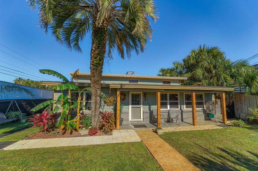 OMG! This charming bungalow has some really cool features. Starting with the eclectic interior which has 1960's vintage style colored tiles. Several rooms have vaulted or beamed ceilings, the den/Florida room has two sets of sliding glass doors to the pool and deck area. This unique interior is loaded with charm! The exterior of the home is super private! (rare for the beach area) The home is completely fenced with black vinyl stripping and tropical landscaping . The outside decking has a drop in pool and extends to the lake with dock that is perfect for a canoe or paddle board! There is an outdoor shower with hot & cold water. This home sits on a corner lot in a golf cart friendly community only 500 feet to the GULF! This is an ideal Beach Cottage for so many reasons!