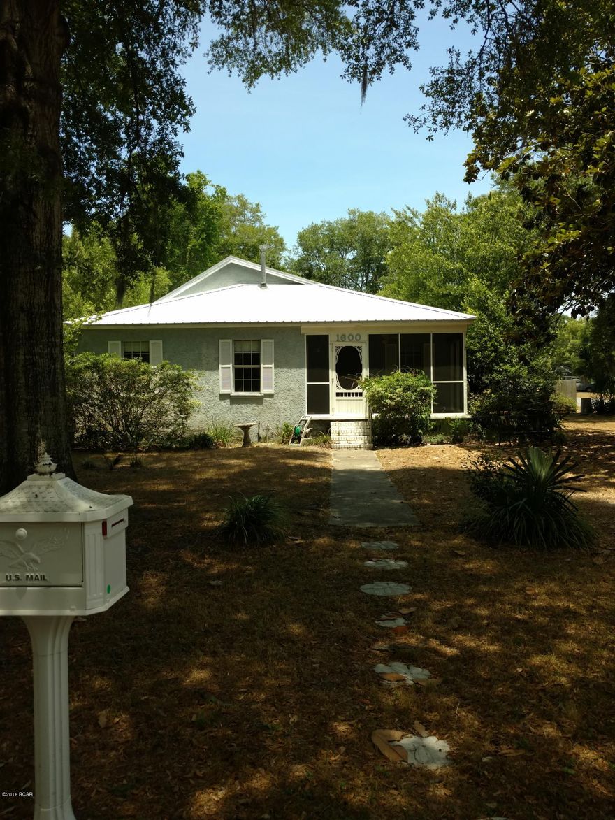 HOT LISTING! SPARKLING TURQUOISE POOL! Effective Year Built 1997! Fabulous Home in Wonderful Hip St. Andrews! 1-1/2 block from St. Andrews Bay and the Millionaire Mansions of Beach Dr- with partial view of Bay! 1 YR HOME/POOL WARRANTY. Cash will produce greater price reduction. $2,000 carpet allowance. Built in 42 & renovated to include wiring & plumbing give it an effective year built of 1997, per prop appraiser. 2 year old metal roof. Victorian Screen doors, screened porches, oversized screen area w/Privacy fencing around back for pool. Tons of character in this home with a huge kitchen, gas stove & custom painted cabinets w/room for an Island! Huge Master w/view of pool & private door to shady secluded porch. Walk to St. Andrews' festivals, restaurants and bars! Go floundering in the Ba $2,000 carpet allowance with acceptable offer.  RPR comparative market analysis program suggested listing at $247,000.  Sellers are highly motiviated to sell due to their next job transfer.  Cash sale will offer greater price discount for fast closing. but offers with preapproved financing will be considered. This is the hottest most desied area of Bay County. Due to constant congestion and disention at the beach, we are seeing more home buyers retire to St. Andrews. It is surrounded by water. Has a wonderful city marine. Many restaurants, bars, art galleries, antique shops. Farmers Market on Saturdays. Parades, the amazing St. Andrews Oaks Parks with tons of century oaks and lighting right on the Bay. A favorite spot for Prom pictures, weddings and picnics. We welcome to move to St. Andrews and enjoy a walking, waterfront community.  We love it here!