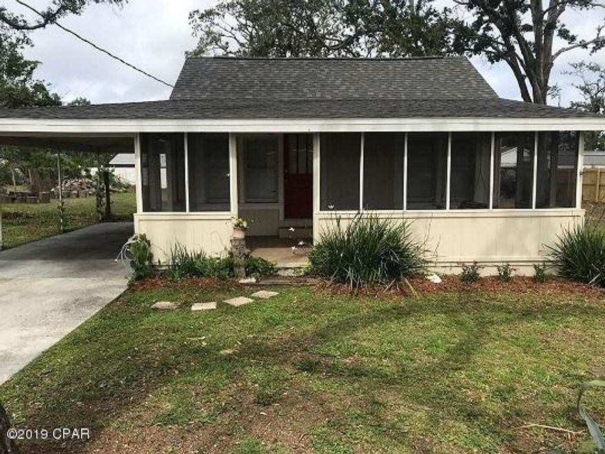 'CURRENTLY UNDER CONTRACT, SELLER ACCEPTING BACKUP OFFERS' Cute 1940's cottage on a very large lot in the center of Panama City(107' X 140'). With original hardwood floors, nice covered front porch, wood burning stove, large kitchen, separate dining room and easy access to amenities in town and on the beach this home is a perfect starter home. Home has a new roof since hurricane Michael. There is a large storage bldg.  This charming home is being offered for sale AS-IS.  All room dimensions are approximate.