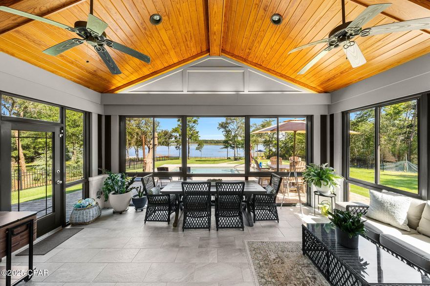 CURRENTLY UNDER CONTRACT, SELLER WILL CONSIDER BACKUP OFFERS

Welcome to 169 Lake Merial Blvd., a rare lakefront estate set on nearly an acre, privately positioned at the edge of the prestigious, gated Lake Merial community. With just one neighboring home and unmatched privacy, this residence offers more than 3,000 sq ft of elegant living space overlooking the sparkling, spring-fed waters of Lake Merial.

Inside, you'll find timeless hardwood flooring, double tray ceilings, and a French-door entry into a handsome office with custom built-ins. The flowing layout connects a formal dining space, open living area, and a spacious kitchen with oak cabinetry, granite counters, and a custom brick-accented sitting area finished in crisp white. A newly finished heated and cooled Florida room, with its tongue-and-groove vaulted ceiling and panoramic windows, delivers uninterrupted lake views year-round.

On the main level, the home includes three bedrooms and two bathrooms, while the upstairs bonus room provides the flexibility to be a fourth bedroom, playroom, or creative retreat. The private primary suite feels like a retreat of its own with its own sitting area, featuring sweeping water views, a spa-inspired ensuite with soaking tub, double vanity, and walk-in shower, and a custom closet designed for organization and elegance.

Outdoor living reaches new heights with a brand-new 11x22 saltwater pool and sun ledge, firepit gathering area, and a paver stone walkway that leads to your private waterfront. Additional updates include fresh interior and exterior paint, redesigned black metal fencing for unobstructed views, a new 12-zone irrigation system with sod, a new well pump, updated bathrooms, and an HVAC system that is only a few years old.

Lake Merial offers 300 acres of spring-fed water for kayaking, paddleboarding, and fishing, along with community trails, green spaces, and holiday gatherings. 

Set on nearly an acre with unmatched privacy, this estate delivers the perfect balance of luxury, nature, and lifestyle. From festive holiday events to food-truck nights and golf-cart cruising, Lake Merial offers a lifestyle as vibrant as it is relaxing. Schedule your private showing today and experience why this is one of the most coveted waterfront addresses in Bay County.