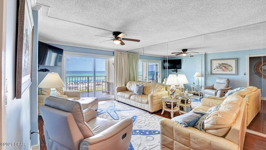 Talk about your chance to own one of the best, fully furnished, 3-bedroom 2 bath condos on Panama City Beach! The complex features 24-hr security, 2 full size pools (1 Heated), a 10 person in-door hot tub, and a full tiki-bar. Beach access gates are locked and accessible only by owners and their guest. Parking is reserved for each unit. This unit has had a full makeover. See Supplement. Talk about your chance to own one of the best, fully furnished, 3-bedroom 2 bath condos on Panama City Beach! The complex features 24-hr security, 2 full size pools (1 Heated), a 10 person in-door hot tub, and a full tiki-bar. Beach access gates are locked and accessible only by owners and their guest. Parking is reserved for each unit. This unit has had a full makeover. The 2 full size bathrooms have new tile and vanities with marble counter tops. New paint throughout. The kitchen has Corian counter tops and nice whirlpool appliances. The kitchen also has an undercounter ice maker. All fixtures have been upgraded through-out the unit.  The master has an adjustable bed with Tempur-Pedic mattress. The 2nd bathroom features an updated walk-in shower and full-size bathtub. The 2nd bedroom has a king bed with Tempur-Pedic mattress. The 3rd bedroom has 2 queen beds. The unit has new wall mounted smart TVs in each bedroom and a new 60" smart TV in the living room. All windows have been upgraded to energy efficient models as well as storm protection. The front door was replaced with a hurricane proof metal door and includes an ARLO camera doorbell. All closets have organizers for easy storage. The unit has all new LVP flooring, 3 yr. old water heater, new plantation shutters, and new professionally installed custom lined drapes on both sliding glass doors in the master and living room. This is a RENTAL machine and produces gross rental numbers close to 60k-75k+. Hurry as this one wont last long.
